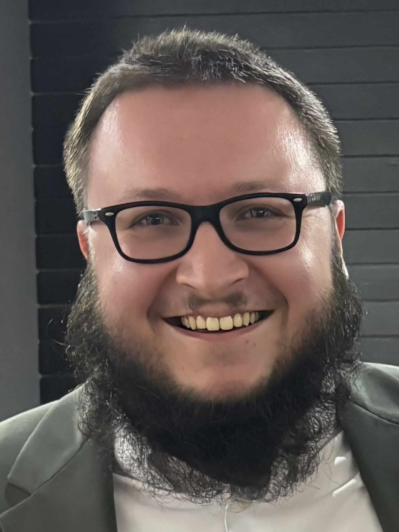 very handsome man with a big smile